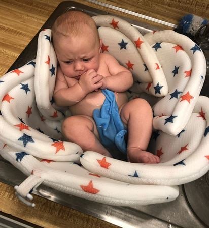 A baby in a sink