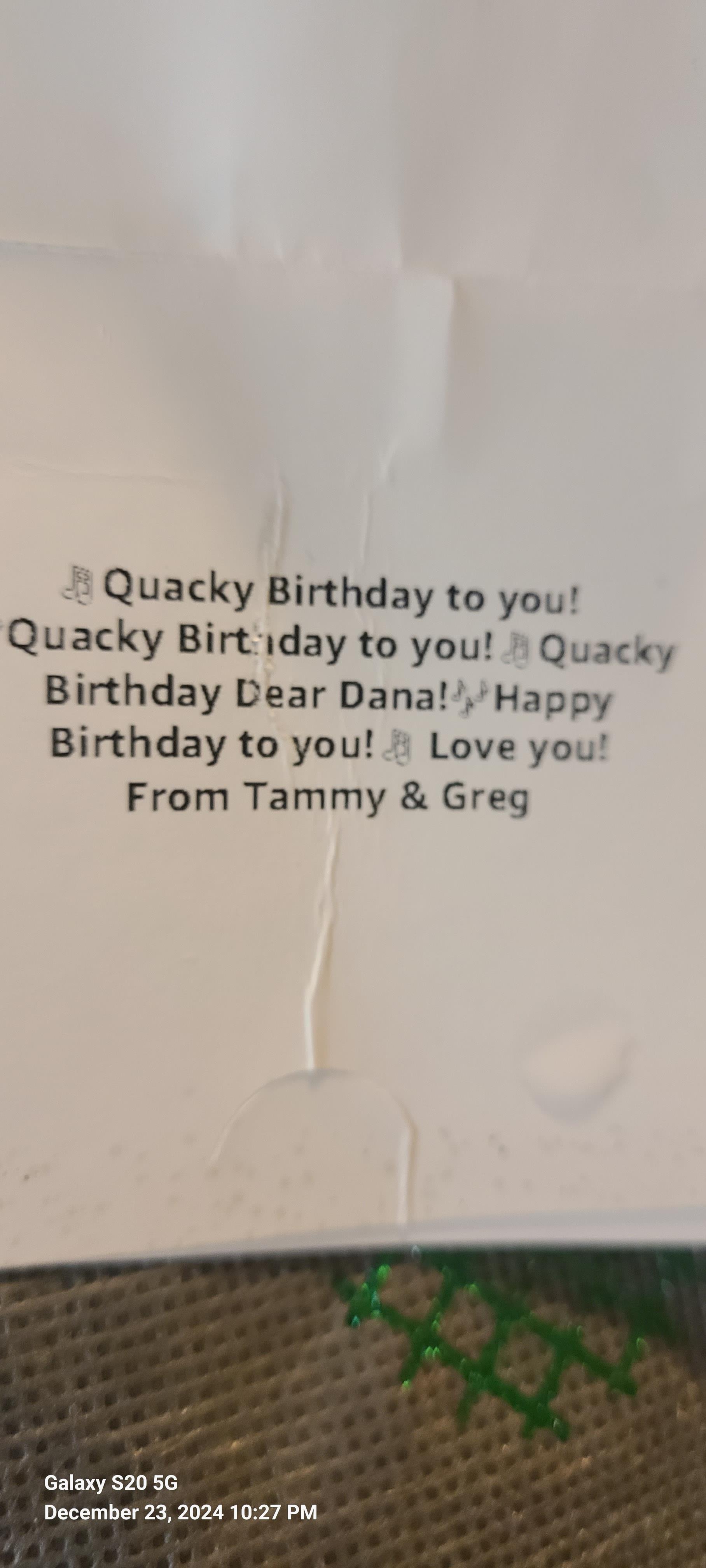A fun birthday card features a whimsical message wishing Dana a joyous celebration.