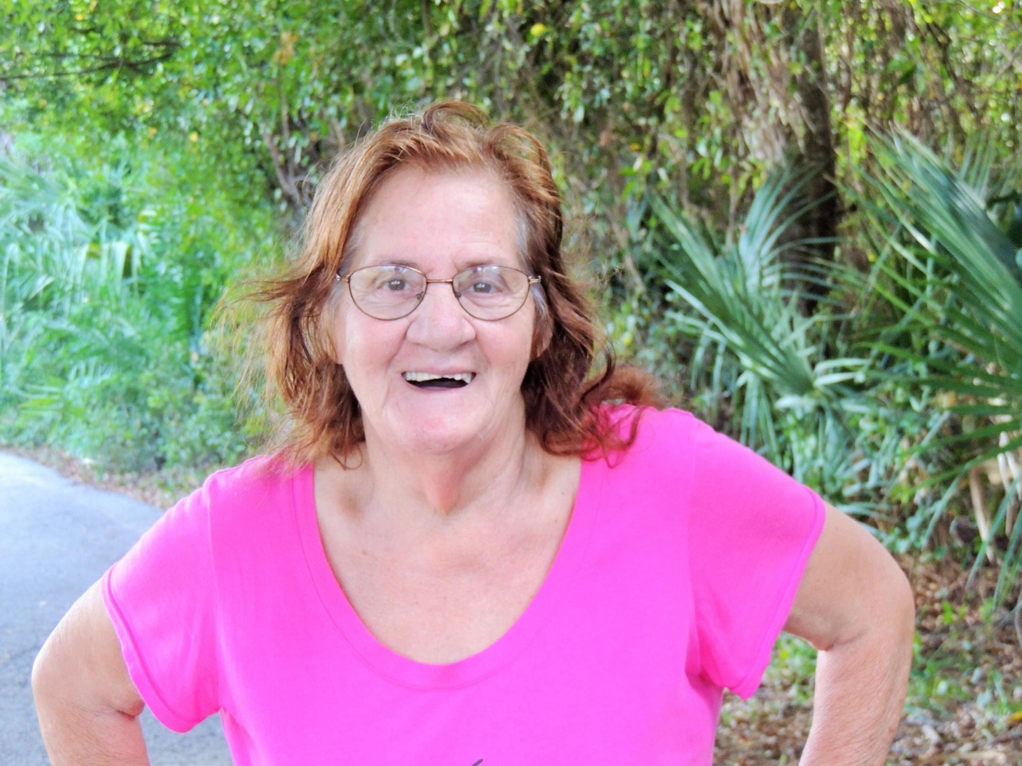 A woman in a pink shirt