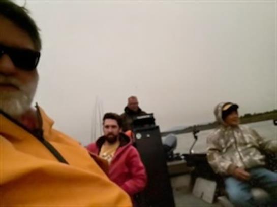 A group of people sitting on a boat