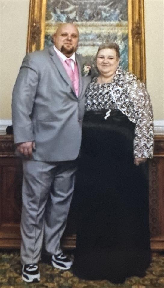 A man and woman posing for a picture