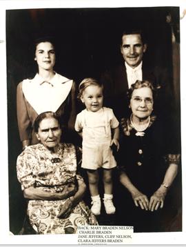 A nostalgic family gathering shows three generations together, sharing a timeless moment of joy.