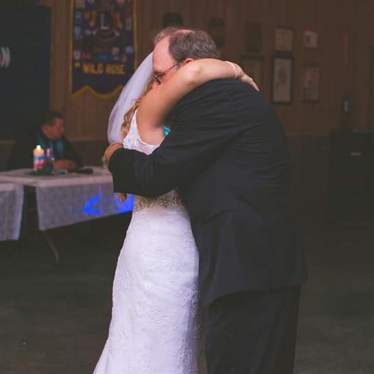 A man and woman hugging