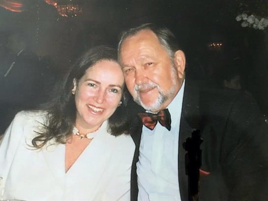 A man and woman posing for a picture