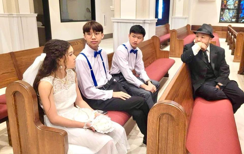 A group of people sitting on benches