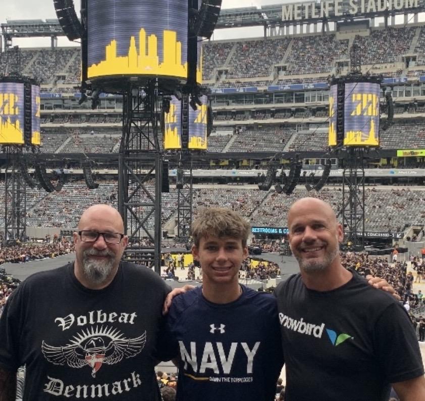 A group of men posing for a picture in a stadium