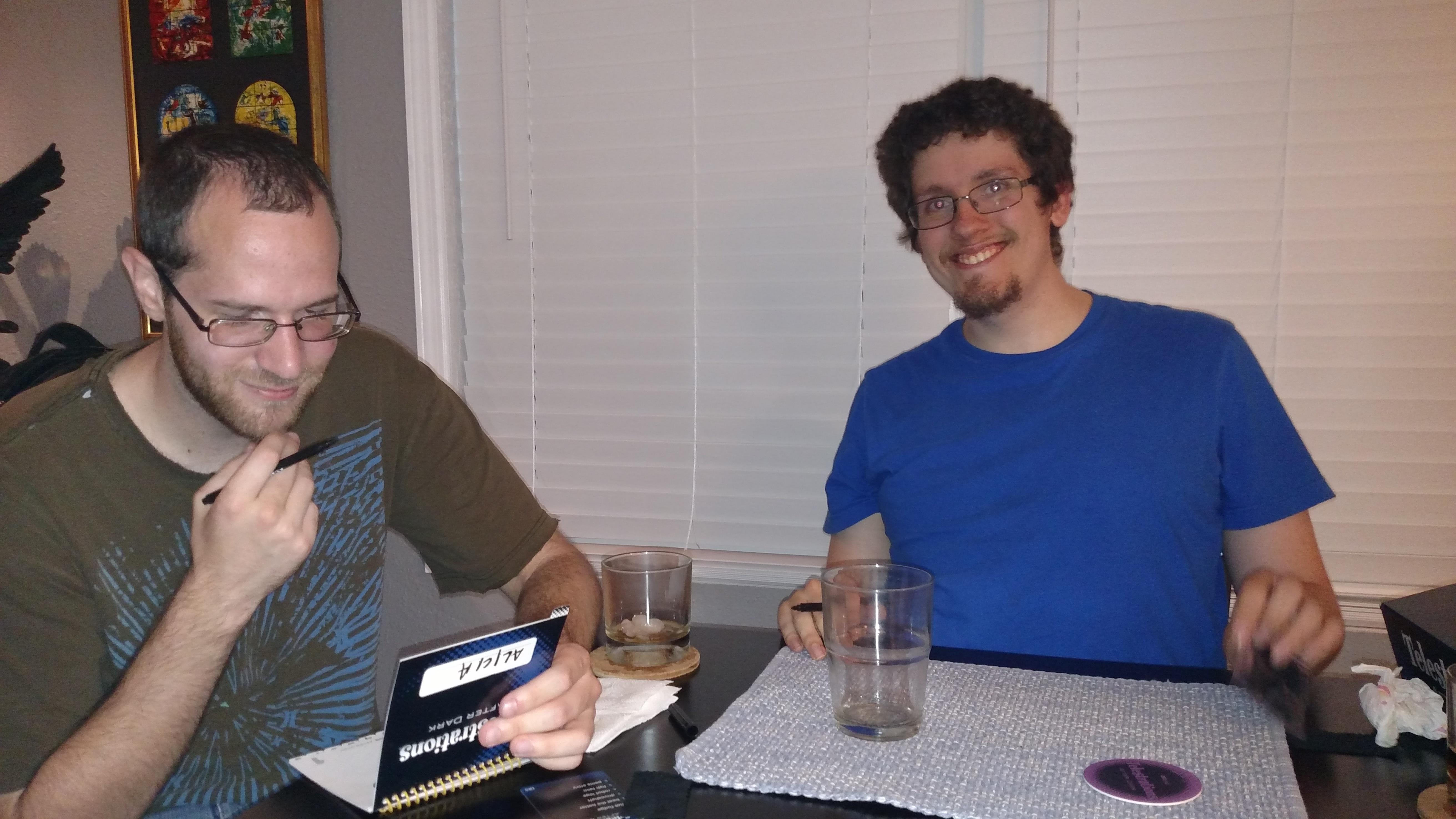 A couple of men sitting at a table