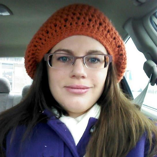 A woman in a hat and glasses