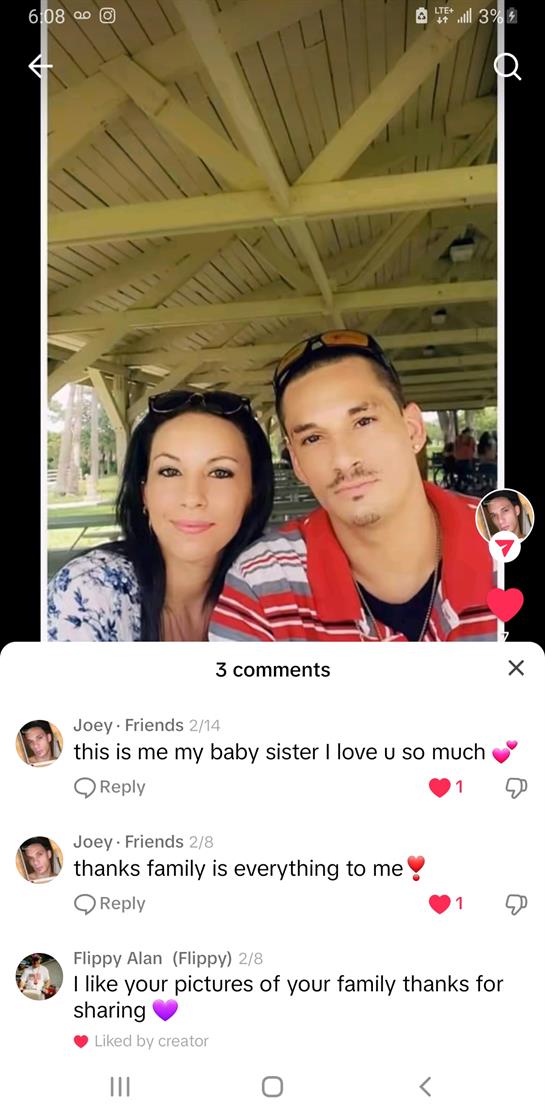 A couple poses together at a park pavilion with natural light and a relaxed atmosphere.