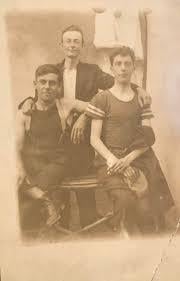 A group of men posing for a photo