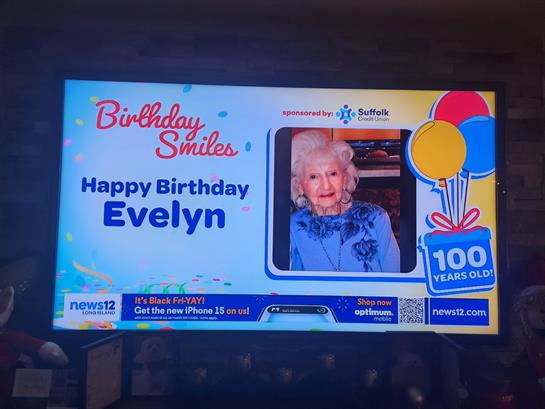A vibrant birthday message honoring Evelyn, who is celebrating her 100th birthday today.