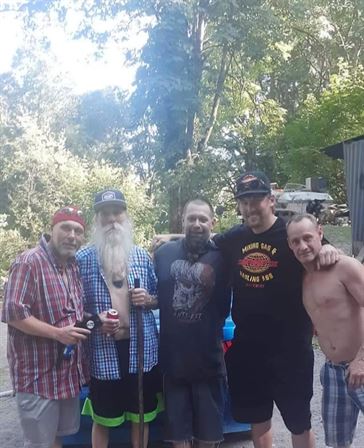 A group of men posing for a photo