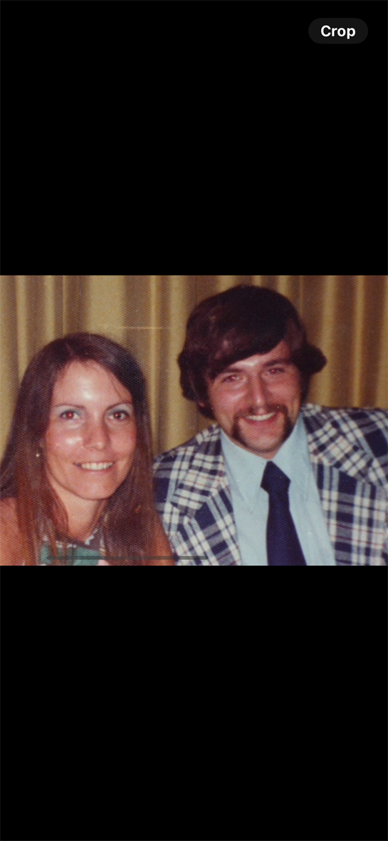 A man and woman smiling for a picture
