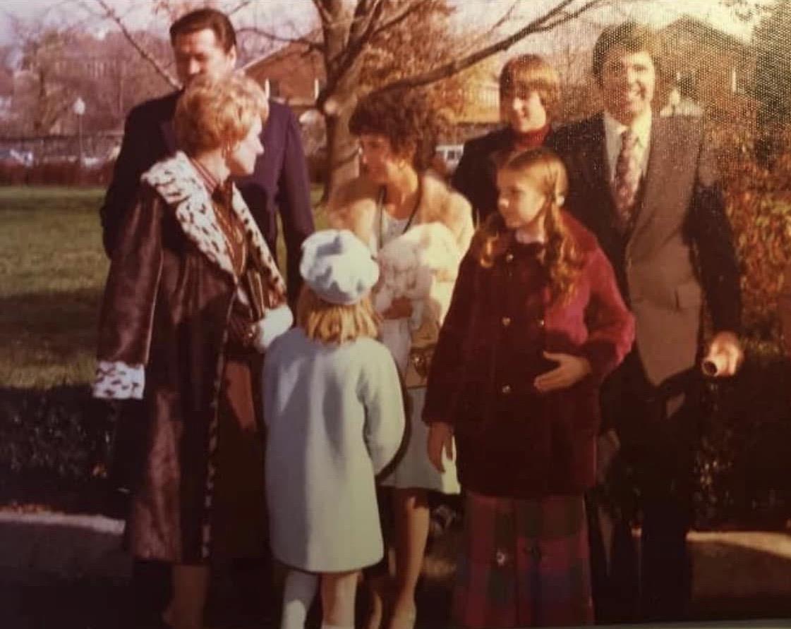 A group of people standing outside