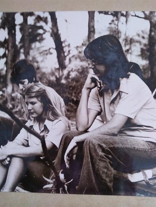 A group of people sitting outside