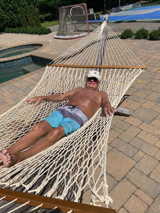 A man lying in a hammock
