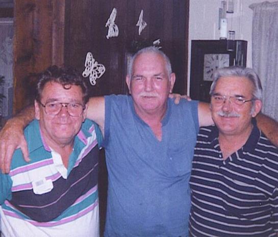 A group of men posing for a picture