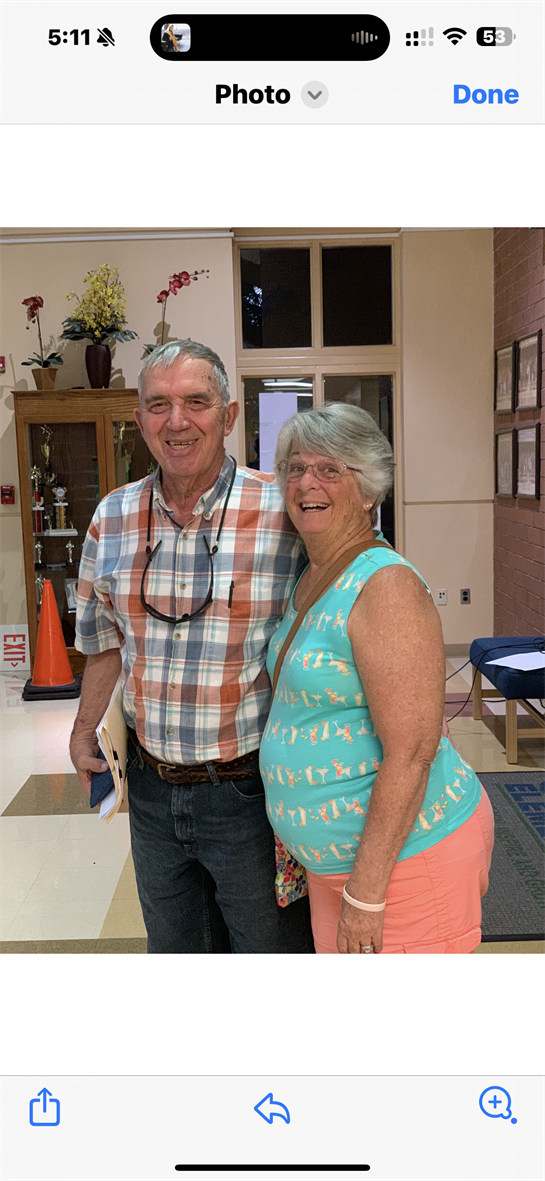 Seniors smile together at a community center, sharing joy and warmth with each other.