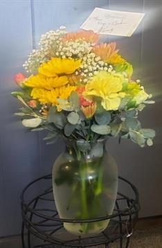 A vase of flowers on a table