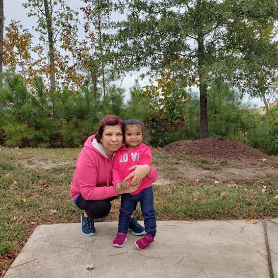 A woman and a child posing for a picture