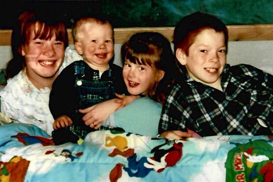 A group of children smiling for a photo