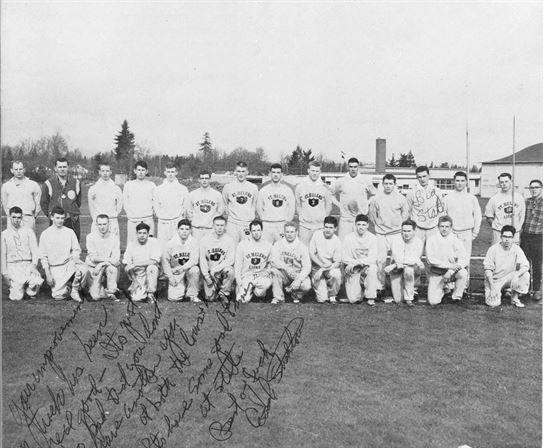 A group of men posing for a photo