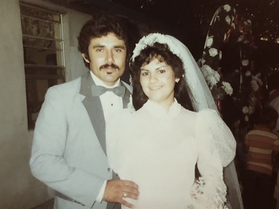A man and woman posing for a picture