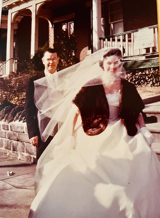 A man in a suit and a woman in a wedding dress