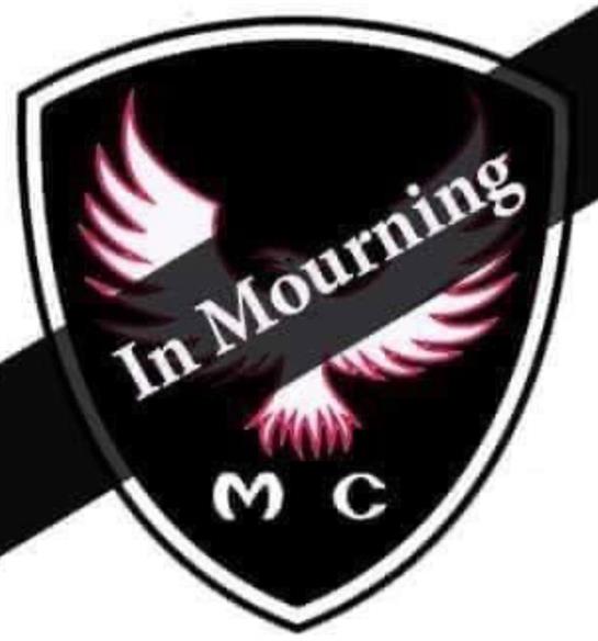 A black shield with white text and pink bird