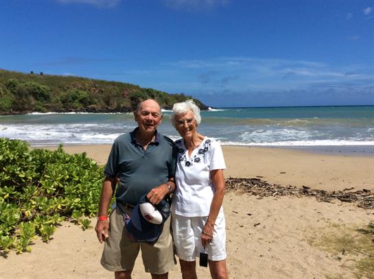 A man and woman standing on a beach