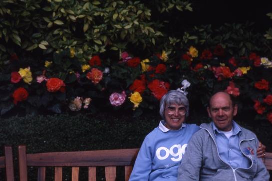 A man and woman sitting on a bench