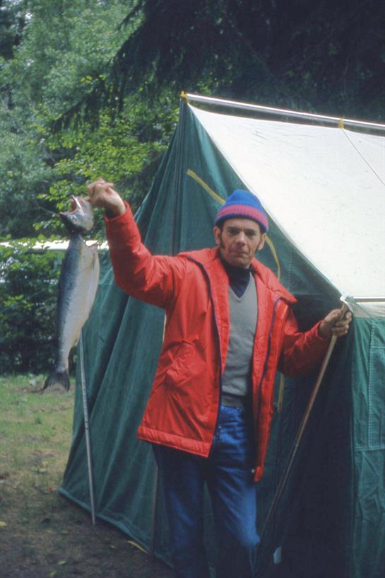 A man holding a fish in his hand
