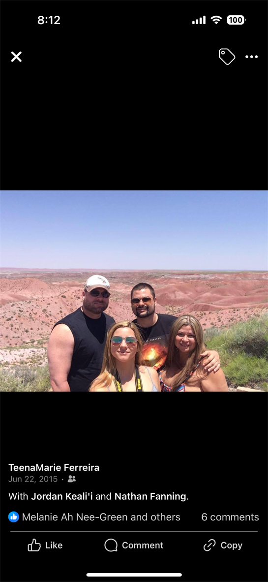 Friends gather at a stunning desert viewpoint, sharing laughter and memories on a sunny day.