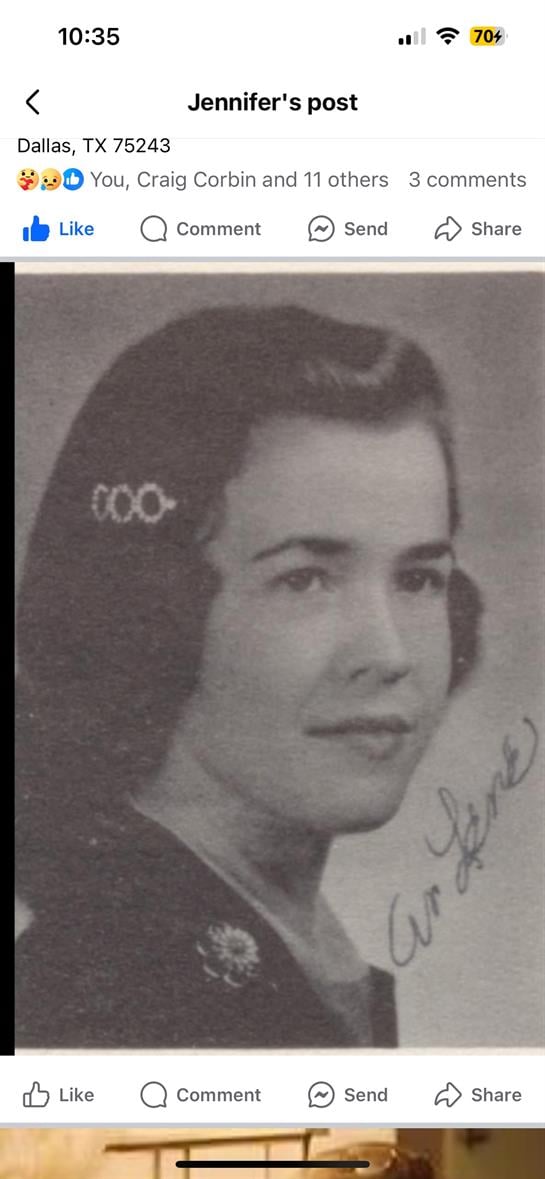 A young woman poses with a charming smile, showcasing her vintage hairstyle from the 1950s.