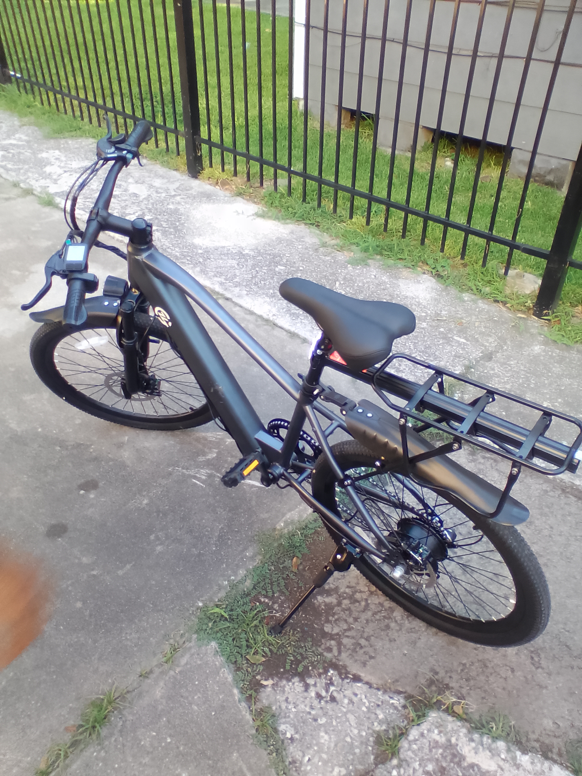 A bicycle parked on a sidewalk