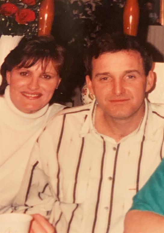 A man and woman smiling for a picture
