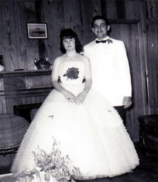 A man and woman in a wedding dress