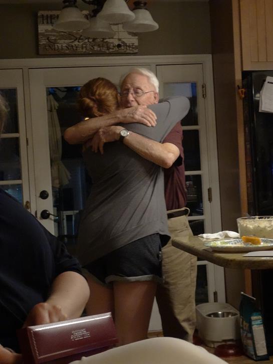 A man and woman hugging