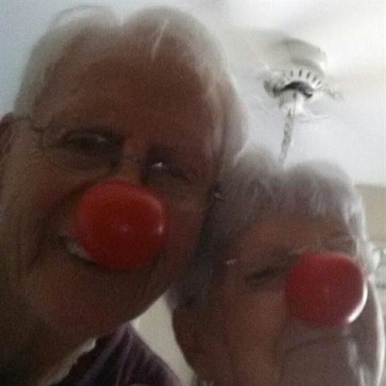 A man and woman with red nose