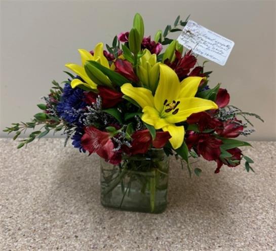 A bouquet of flowers in a glass vase