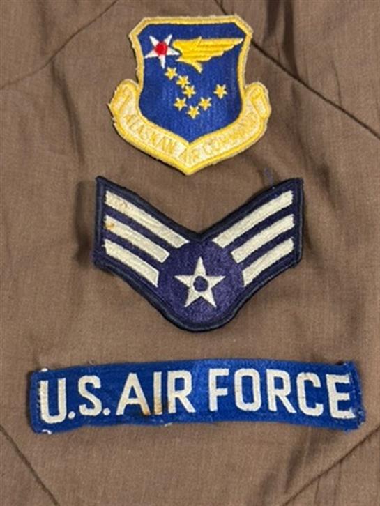 Insignia from a military uniform shows U.S. Air Force patches of rank and symbol.