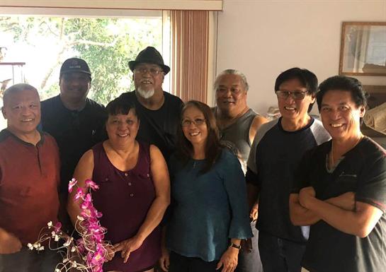 A group of friends enjoys quality time together in a warm, inviting living room.