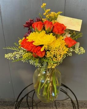 A vase of flowers on a stand