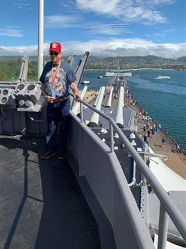 A woman standing on a deck of a ship