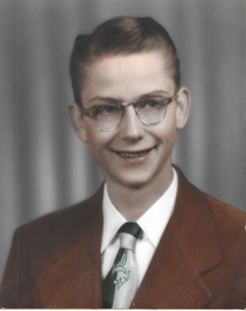 A young man in a suit and tie
