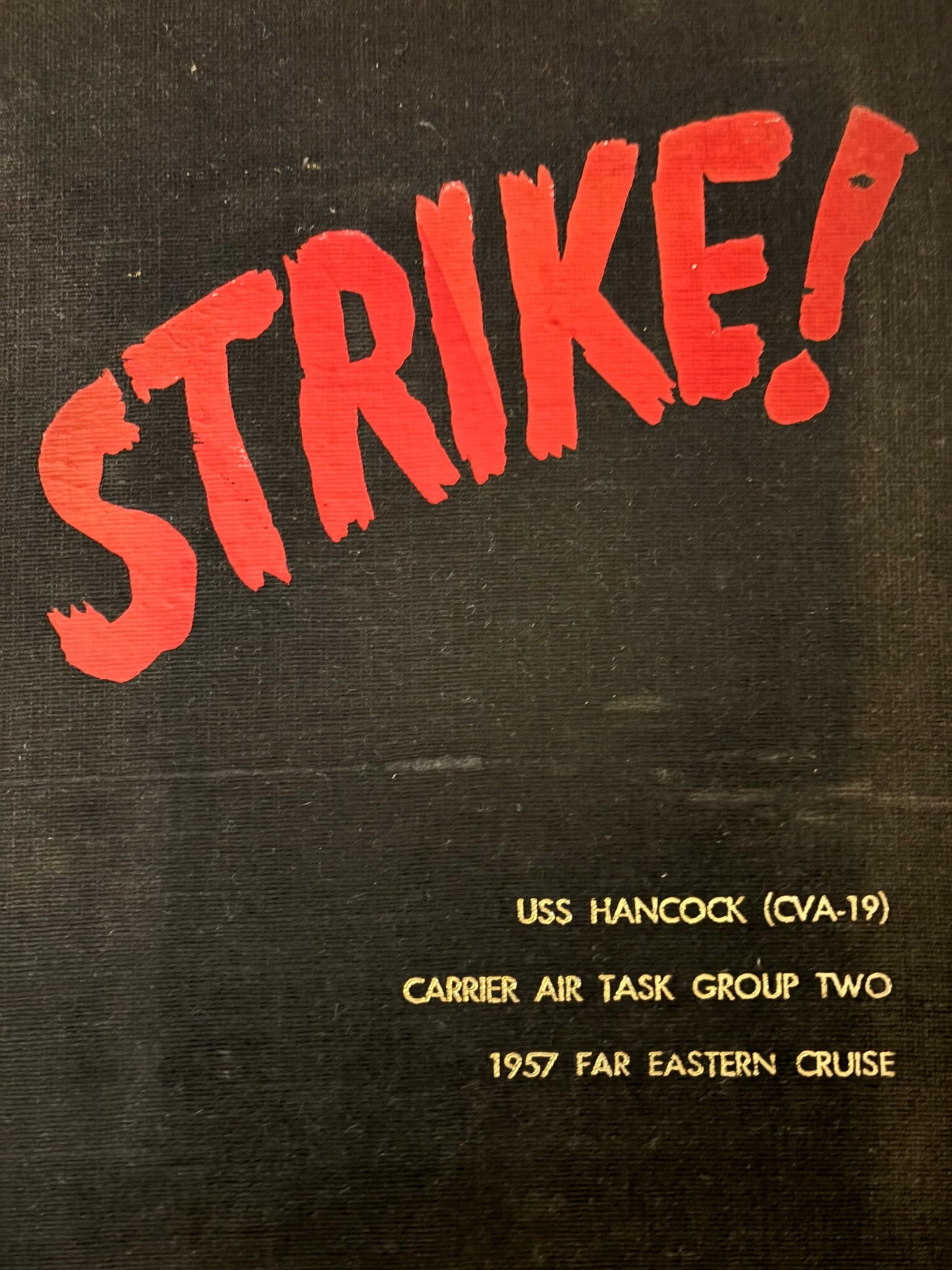 A black and red sign with yellow text