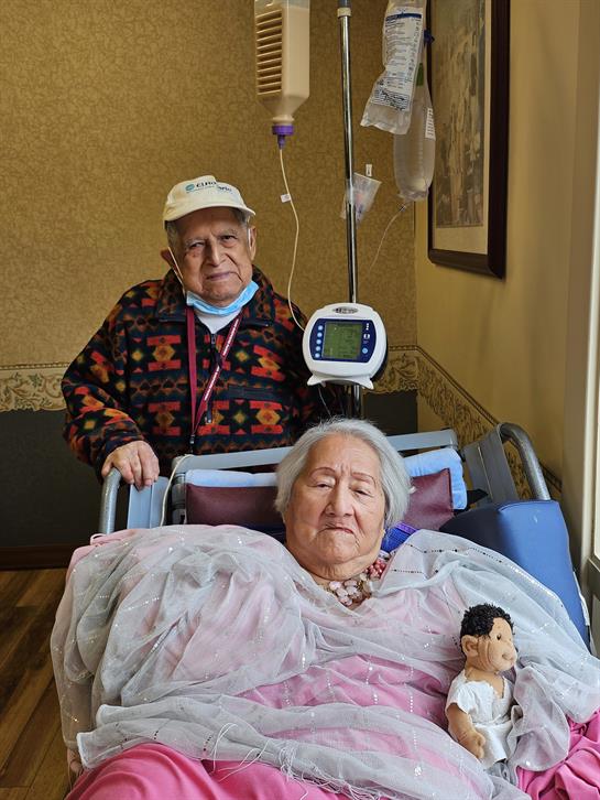 A man and woman in a hospital bed