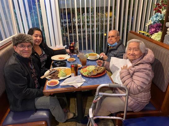 A group of people sitting at a table