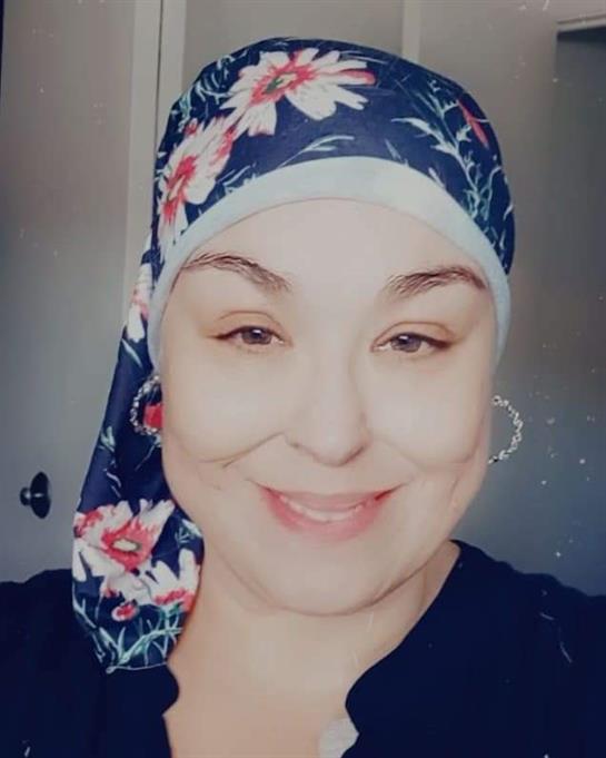 A woman wearing a head scarf