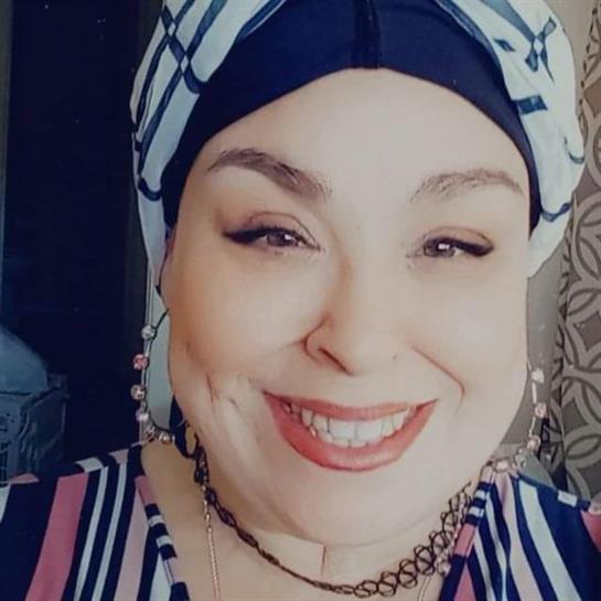 A woman smiling for the camera